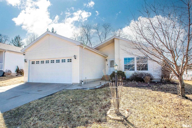 view of front of property featuring driveway and an attached garage