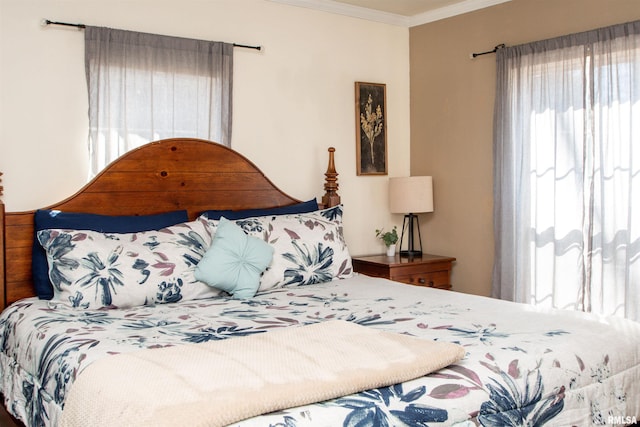 bedroom with crown molding