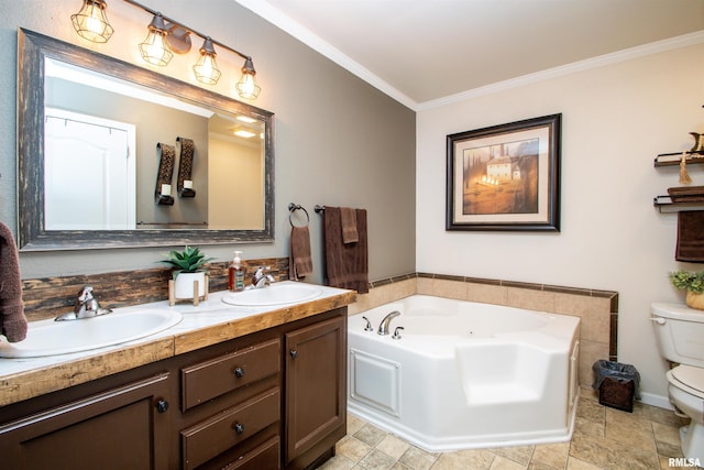 full bathroom with ornamental molding, a tub with jets, a sink, and toilet