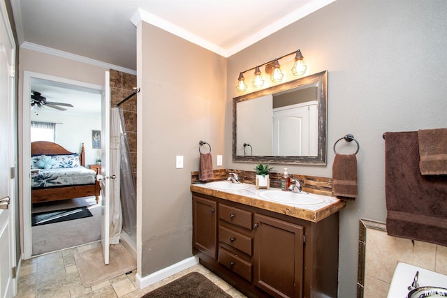 ensuite bathroom featuring ornamental molding, a sink, a shower with shower curtain, and double vanity