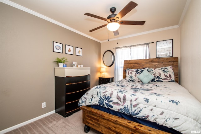 bedroom featuring ornamental molding, light carpet, ceiling fan, and baseboards