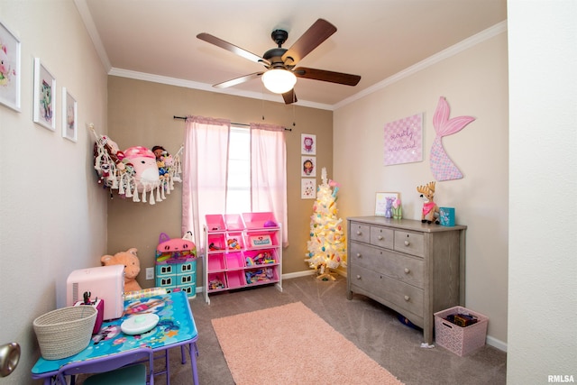 playroom with carpet floors, crown molding, baseboards, and a ceiling fan