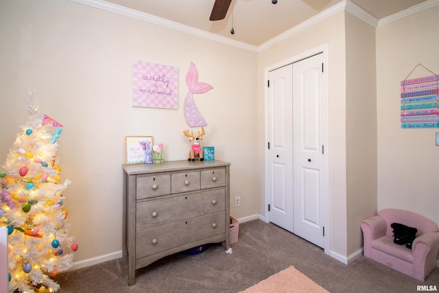 carpeted bedroom with a ceiling fan, a closet, crown molding, and baseboards