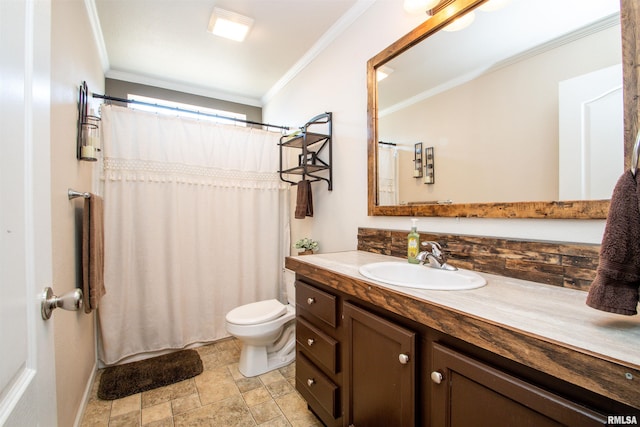 full bathroom featuring curtained shower, toilet, vanity, stone finish flooring, and crown molding