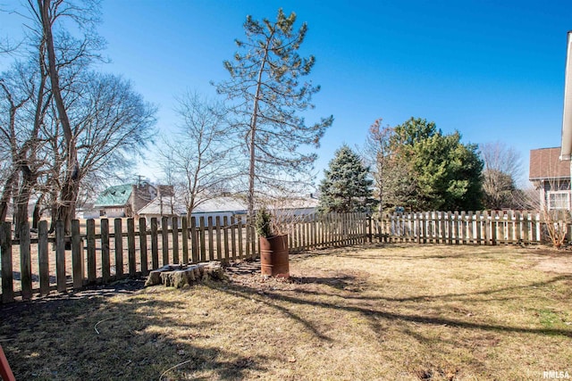 view of yard with a fenced backyard