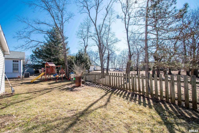 view of yard featuring a fenced front yard and a playground