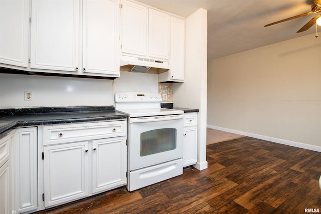 kitchen with white electric stove, under cabinet range hood, dark wood-style flooring, white cabinetry, and dark countertops