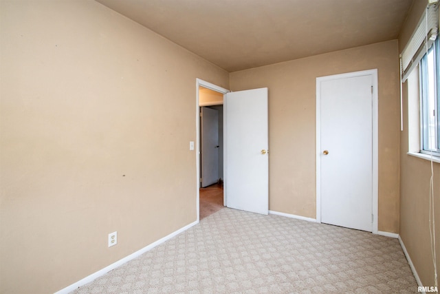 unfurnished bedroom with baseboards