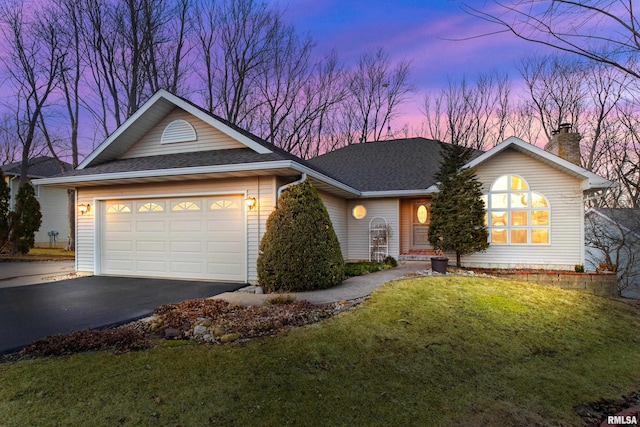 ranch-style home featuring a shingled roof, a front lawn, aphalt driveway, a chimney, and a garage