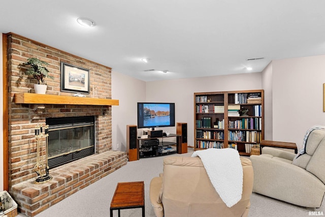 carpeted living area featuring a brick fireplace and visible vents