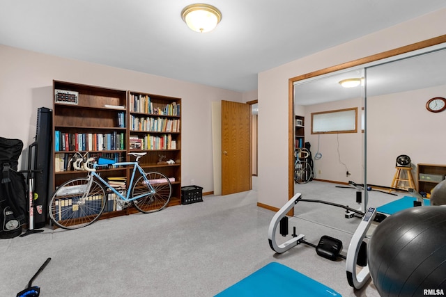 workout area featuring baseboards