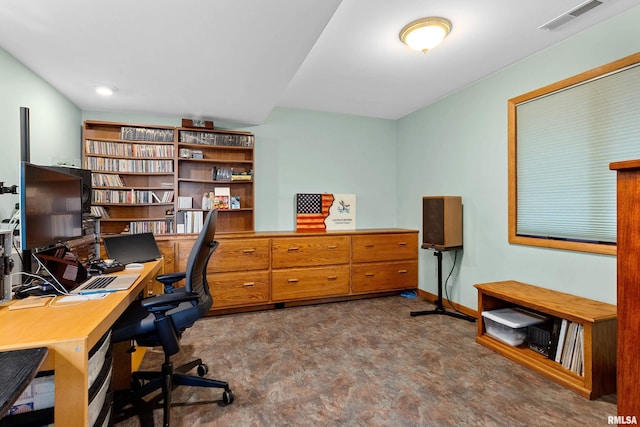 home office with baseboards and visible vents