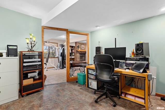 home office with a brick fireplace