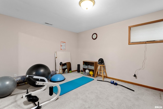 exercise room with visible vents, carpet, and baseboards