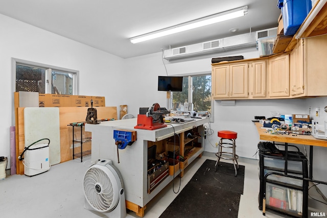 interior space featuring visible vents and a workshop area