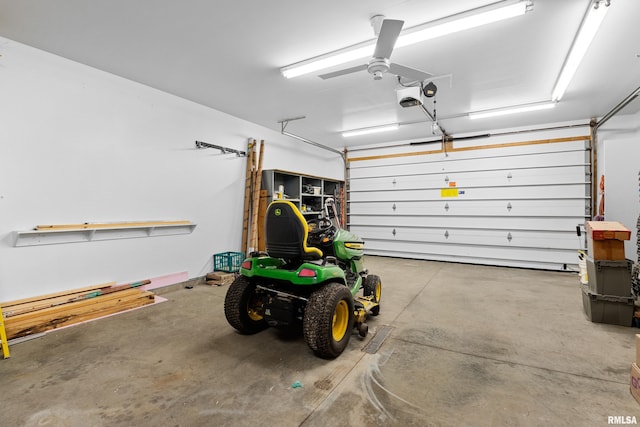 garage with a garage door opener and a ceiling fan