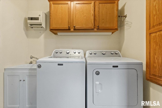 laundry room featuring cabinet space and independent washer and dryer