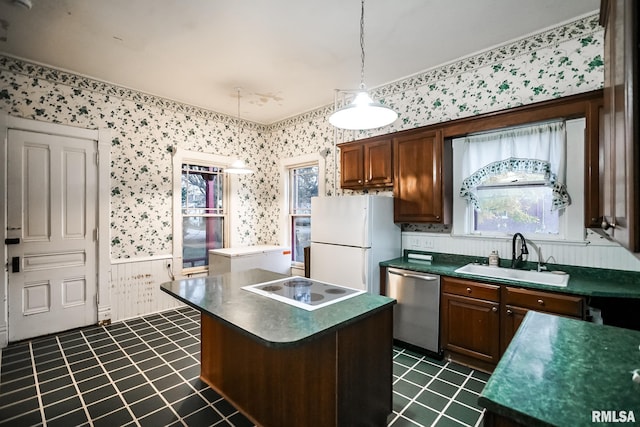 kitchen with a sink, wallpapered walls, dishwasher, and freestanding refrigerator