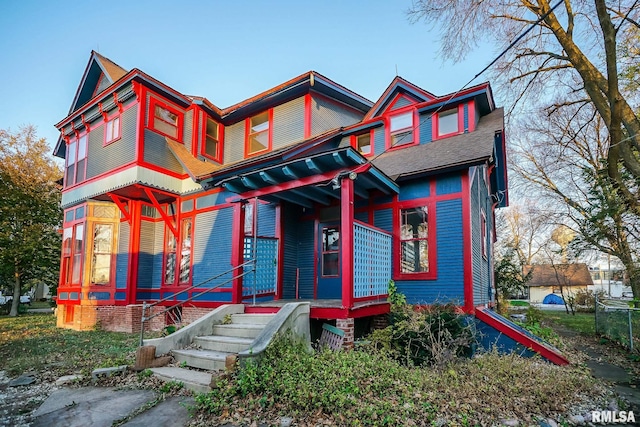 victorian-style house featuring a porch