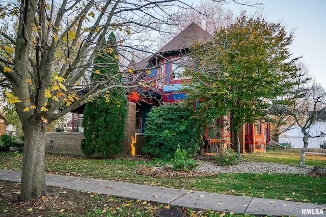 view of side of property with brick siding