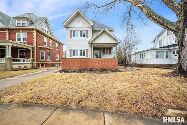 view of front of house featuring brick siding