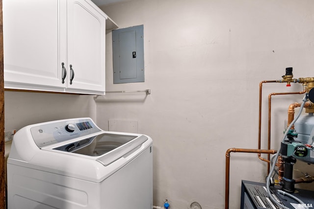 washroom featuring electric panel, cabinet space, and washer / dryer