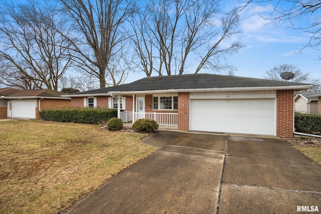 single story home featuring brick siding, an attached garage, concrete driveway, and a front lawn