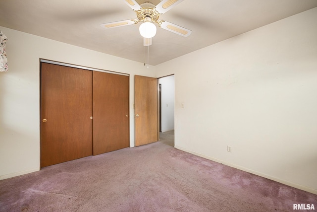 unfurnished bedroom with a closet, a ceiling fan, baseboards, and carpet floors