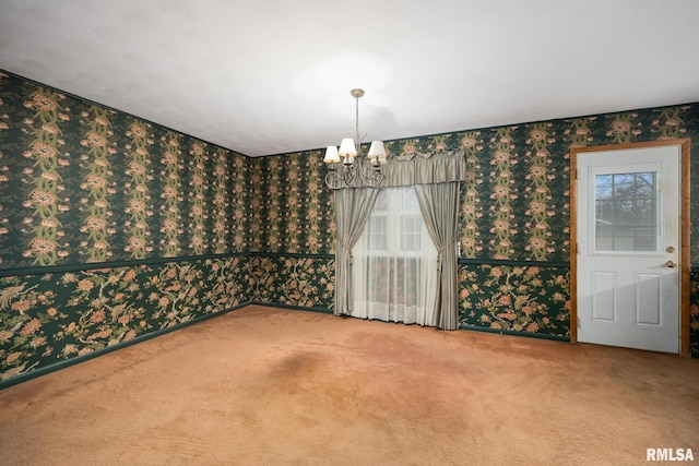 unfurnished dining area featuring a notable chandelier, carpet flooring, and wallpapered walls