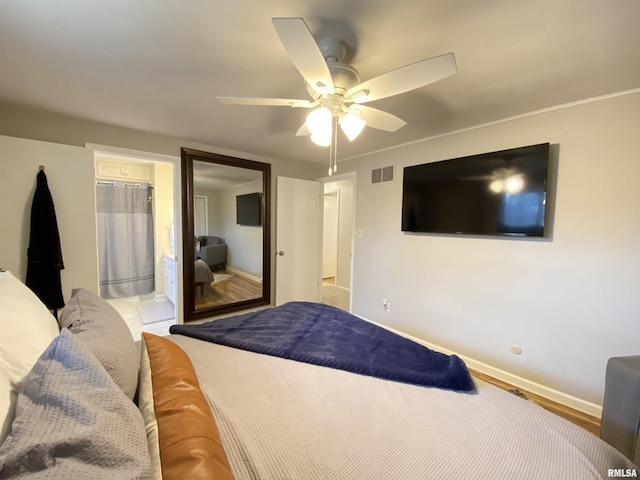 bedroom featuring baseboards, visible vents, and ceiling fan