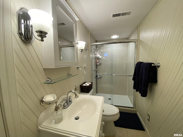 bathroom with tile patterned flooring, a shower stall, toilet, and visible vents