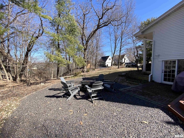 view of yard with a fire pit