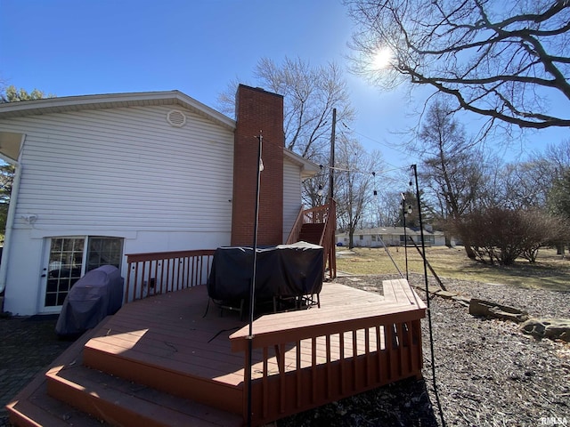 wooden terrace with area for grilling