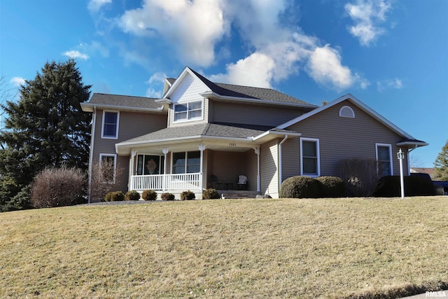 traditional-style home with covered porch and a front yard