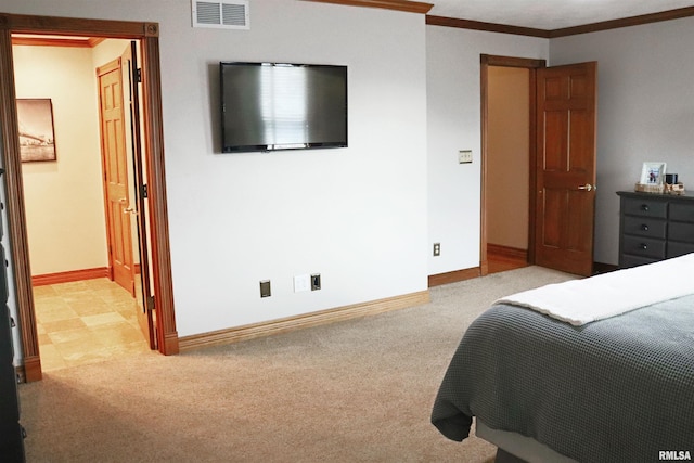 bedroom with visible vents, baseboards, carpet, and ornamental molding