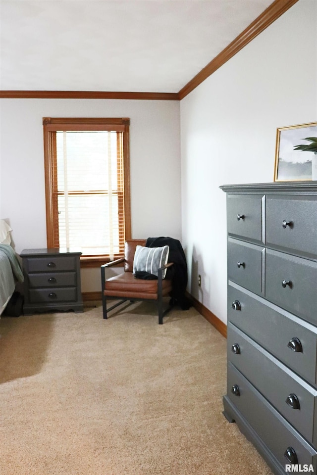 sitting room featuring light colored carpet, baseboards, and ornamental molding