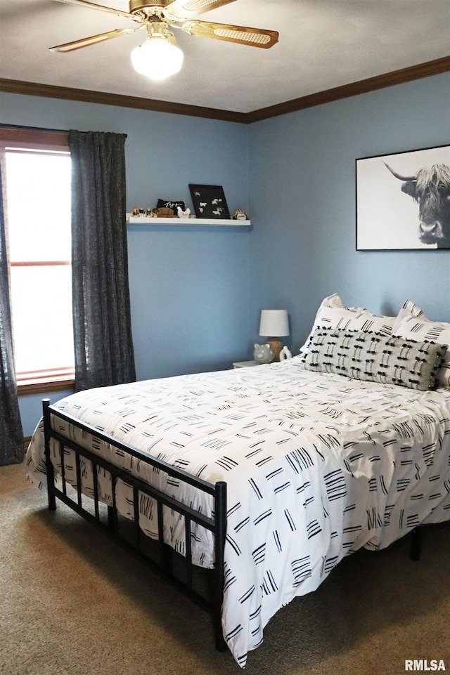 bedroom featuring carpet flooring, crown molding, and ceiling fan