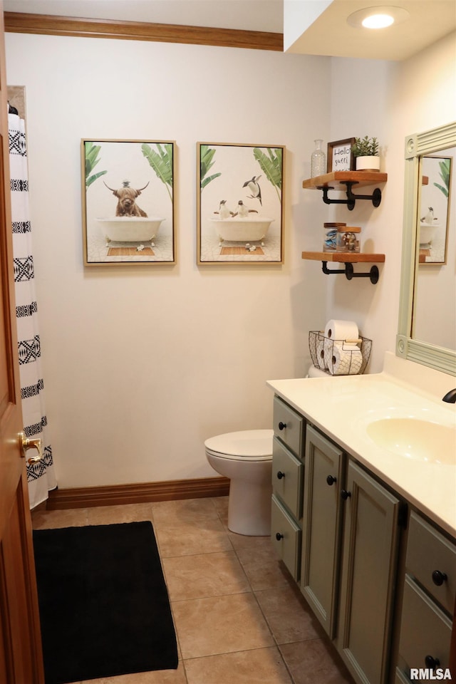 bathroom featuring vanity, baseboards, tile patterned flooring, curtained shower, and toilet