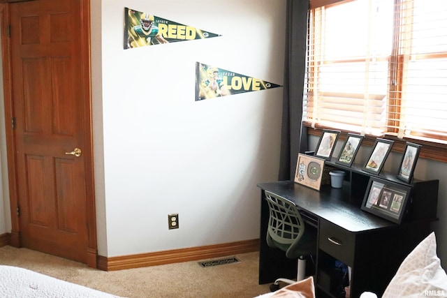 office space with visible vents, carpet flooring, and baseboards