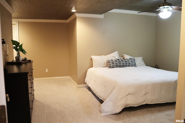 bedroom featuring ornamental molding, ceiling fan, baseboards, and carpet floors