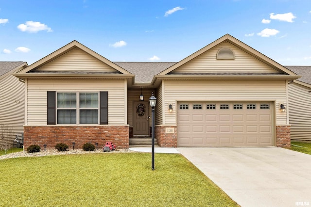 view of front of house with a front yard, brick siding, concrete driveway, and an attached garage