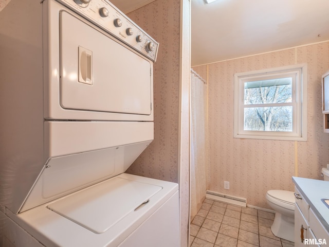 laundry area with wallpapered walls, laundry area, stacked washer and dryer, and a baseboard heating unit