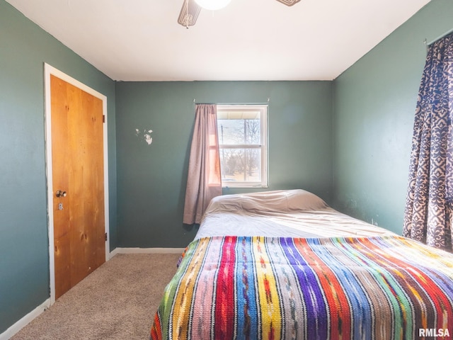 bedroom featuring baseboards and carpet floors