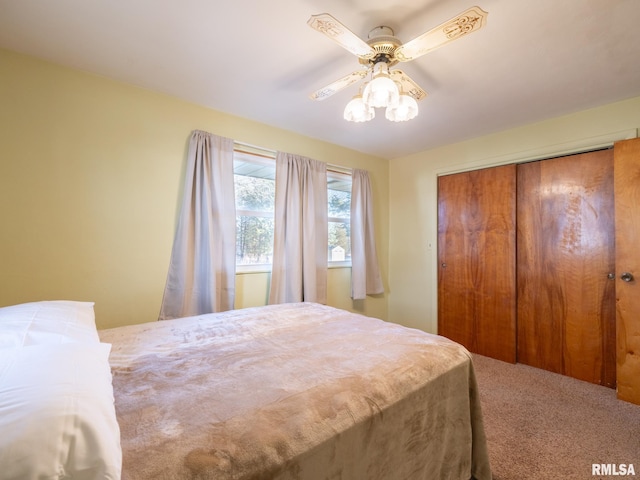 bedroom featuring carpet flooring, a ceiling fan, and a closet