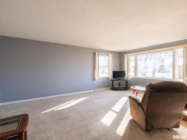 living area with visible vents, baseboards, and carpet flooring