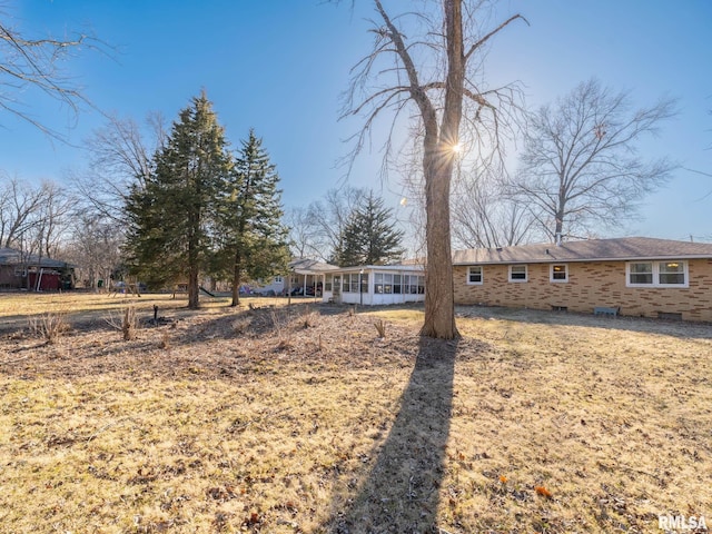 exterior space featuring crawl space and a sunroom