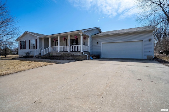 single story home with an attached garage, covered porch, and driveway