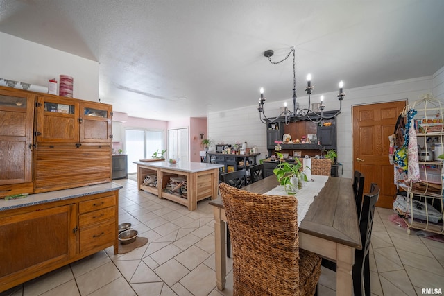 2268 E Knox St, Galesburg, IL 61401 - kitchen featuring light tile patterned floors, open shelves, light countertops, brown cabinets, and a center island