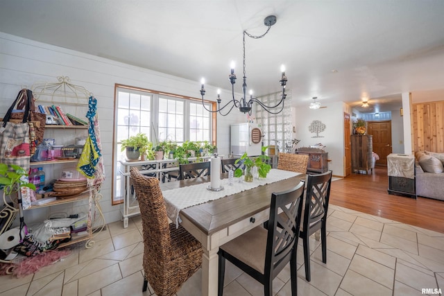 2268 E Knox St, Galesburg, IL 61401 - dining space with a wealth of natural light, light tile patterned floors, and a notable chandelier