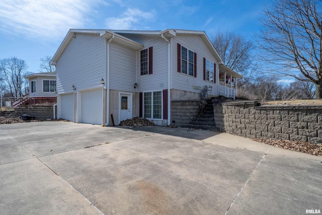 2268 E Knox St, Galesburg, IL 61401 - view of home's exterior with stairs, concrete driveway, and a garage